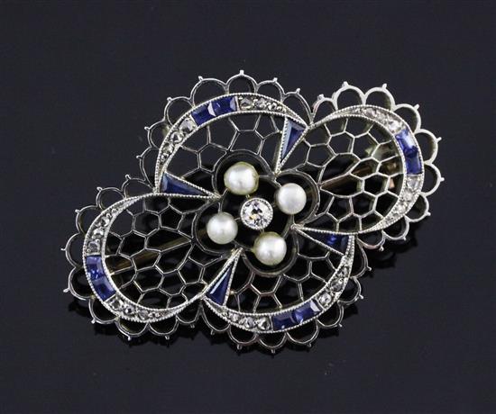 An Edwardian gold, diamond, split pearl and sapphire brooch, 1.5in.